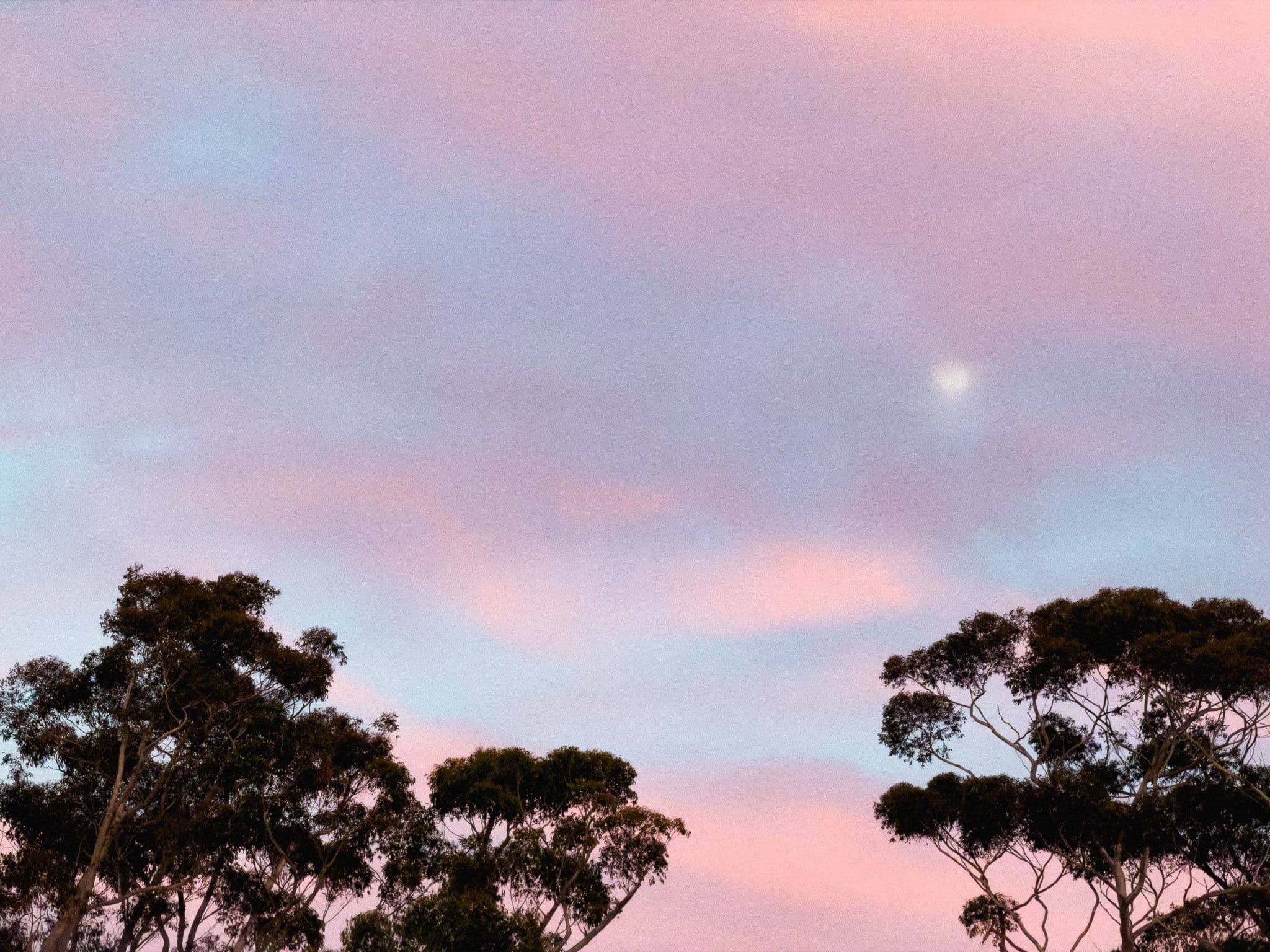 Clouds spread across a blue sky